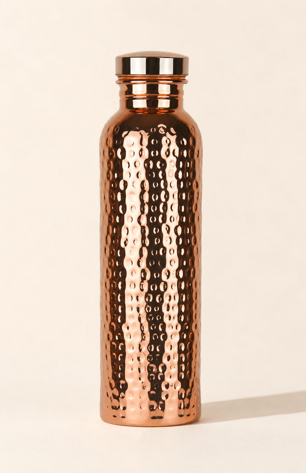 Copper Ritual bottle, angled view showing hammered texture