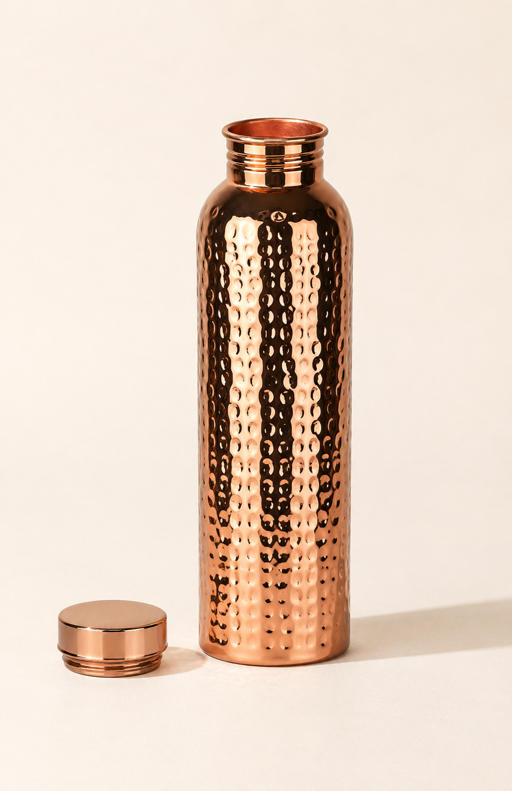 Copper Ritual bottle with cap removed, showing the threaded neck
